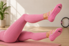 Pink pilates grip socks with heart-shaped anti-slip grips and elastic ballet straps