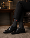 Premium charcoal formal crew socks with subtle triangle logo made from breathable soft cotton blend for office and business wear.