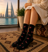 Black socks with red chili pepper pattern design