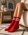 Red crew socks with double white stripe athletic design