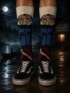 Dark retro-style crew socks featuring a vintage horror-inspired masked character design with blue, black, red, and beige tones.
