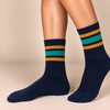 Navy blue crew socks with mustard yellow and teal green retro stripes