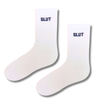White crew socks featuring bold black SLUT text on the ankle