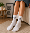 White crew socks with Social Battery 1 percent text design