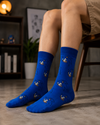 Blue crew socks featuring repeated Sonic character face patterns on a bright blue background