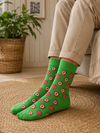 Bright green crew socks with red and white strawberry heart pattern
