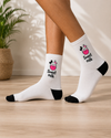 White crew socks with a cute pink cow illustration and Sweet Milk text.