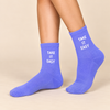 Purple crew socks with white Take It Easy slogan