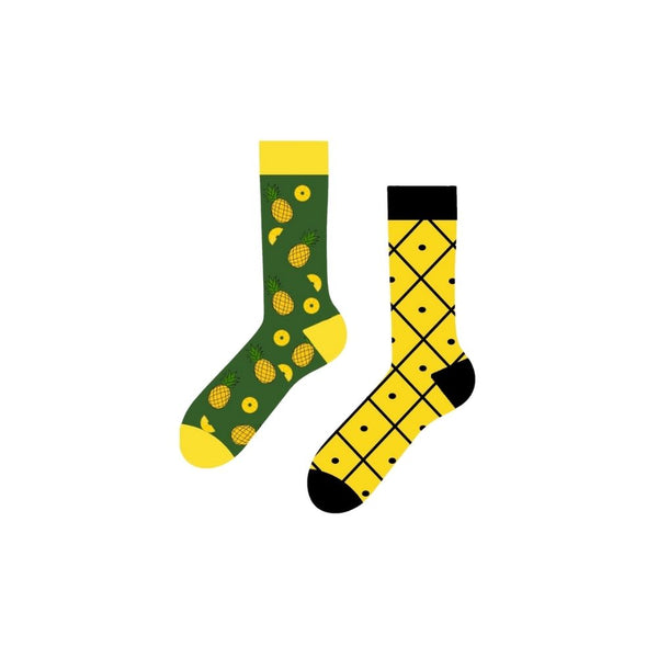 Tropical Pineapple Mismatched Socks! One sock features whole and sliced pineapples on a deep green background