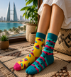 Colorful mismatched watermelon socks with fruit slice and striped watermelon patterns