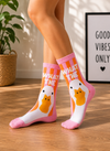 Pink What The Duck Socks featuring a funny white duck illustration and humorous text design.