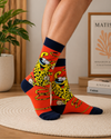 Orange retro cartoon inspired crew socks featuring wild cheetah character artwork