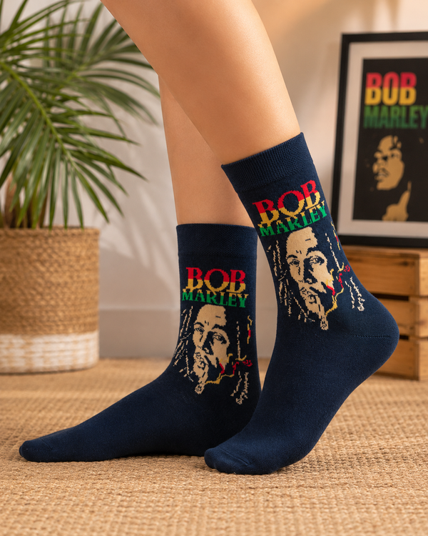 Black crew socks featuring Bob Marley portrait artwork with reggae inspired red yellow and green text design.