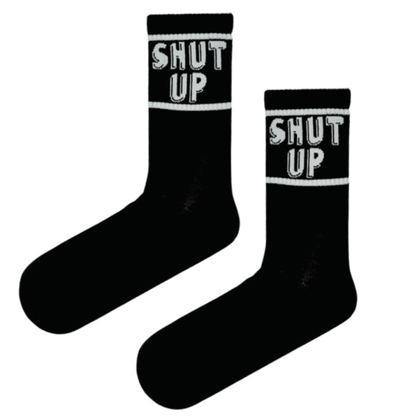 Shut Up Socks – Black Edition. These eye-catching crew-length socks feature a daring design with the words “SHUT UP” boldly stitched on both sides, perfect for those with a cheeky sense of humor.