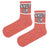 Coral pink crew socks with 'SHUT UP' statement and white and green stripes