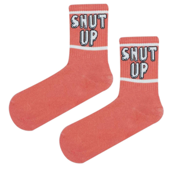 Coral pink crew socks with 'SHUT UP' statement and white and green stripes